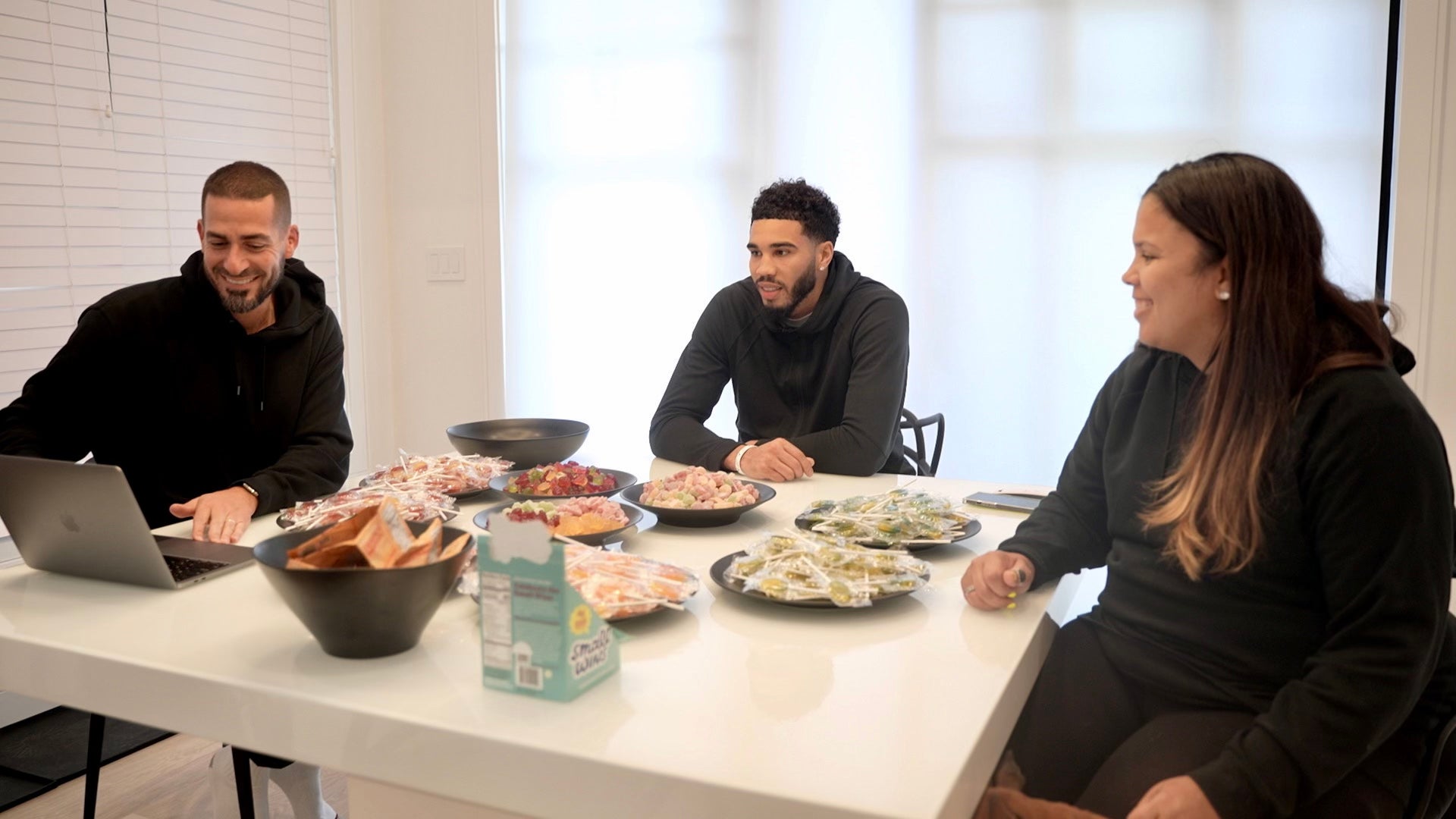 Small Wins team sitting around table with Jayson Tatum